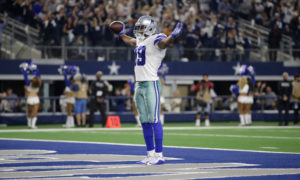 Dallas Cowboys wide receiver Amari Cooper celebrating in the endzone after scoring a touchdown