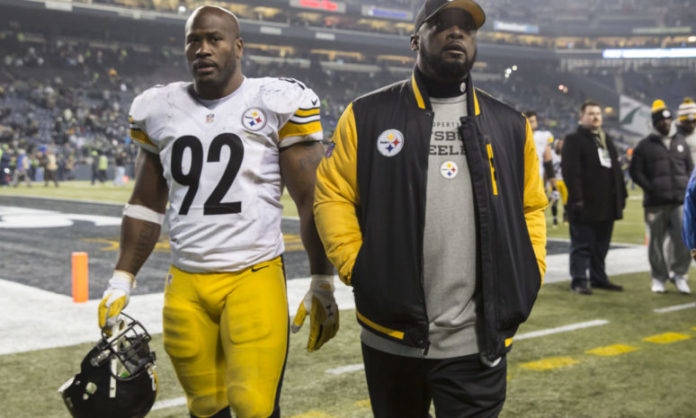 James Harrison walks with Mike Tomlin while part of the Pittsburgh Steelers