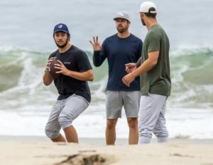 Josh allen throwing on a beach